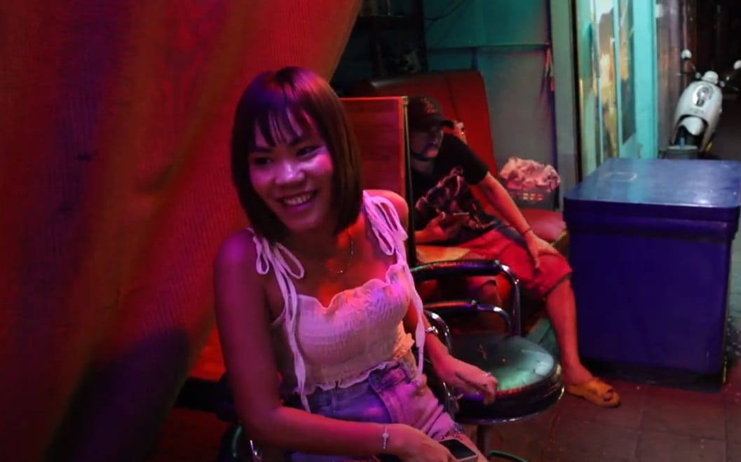 girl in front Thai karaoke bar